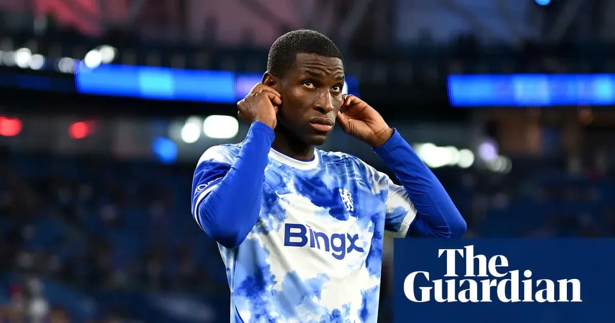 Player adjusting earphones before match on field Player adjusting earphones before match on field