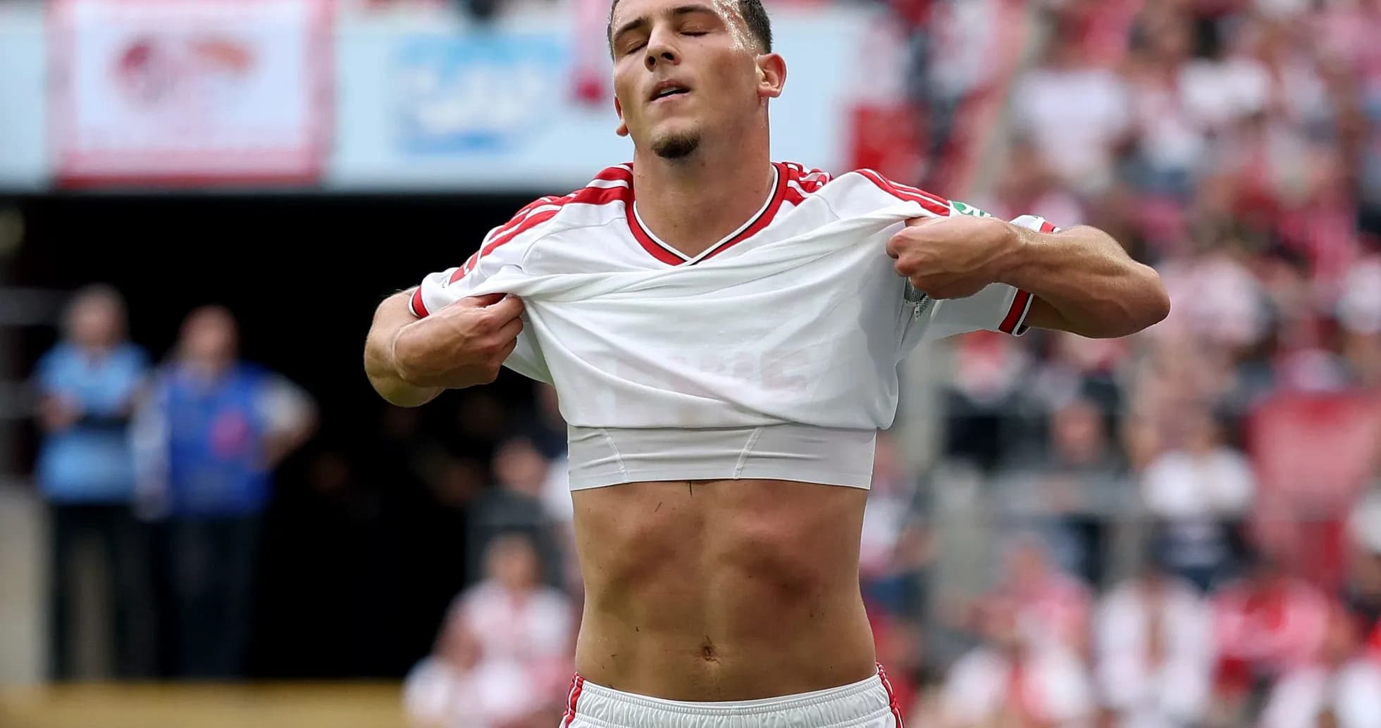 Player lifting shirt during match celebration Player lifting shirt during match celebration