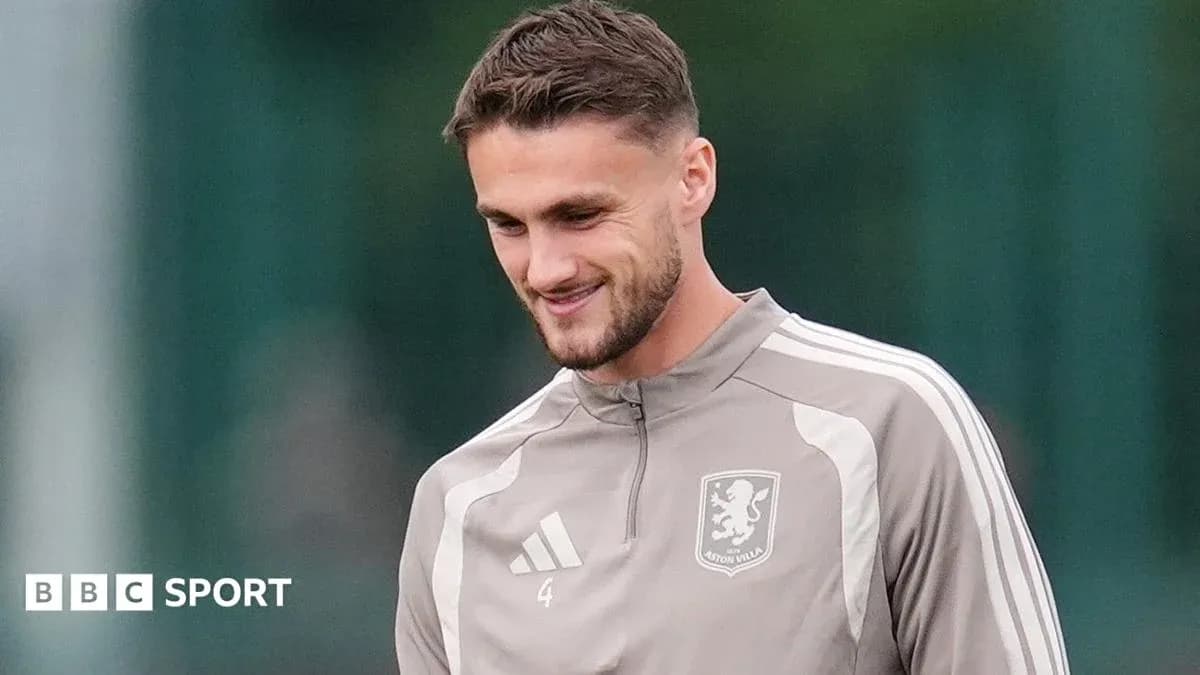 Player in Aston Villa training kit smiling outdoors Player in Aston Villa training kit smiling outdoors