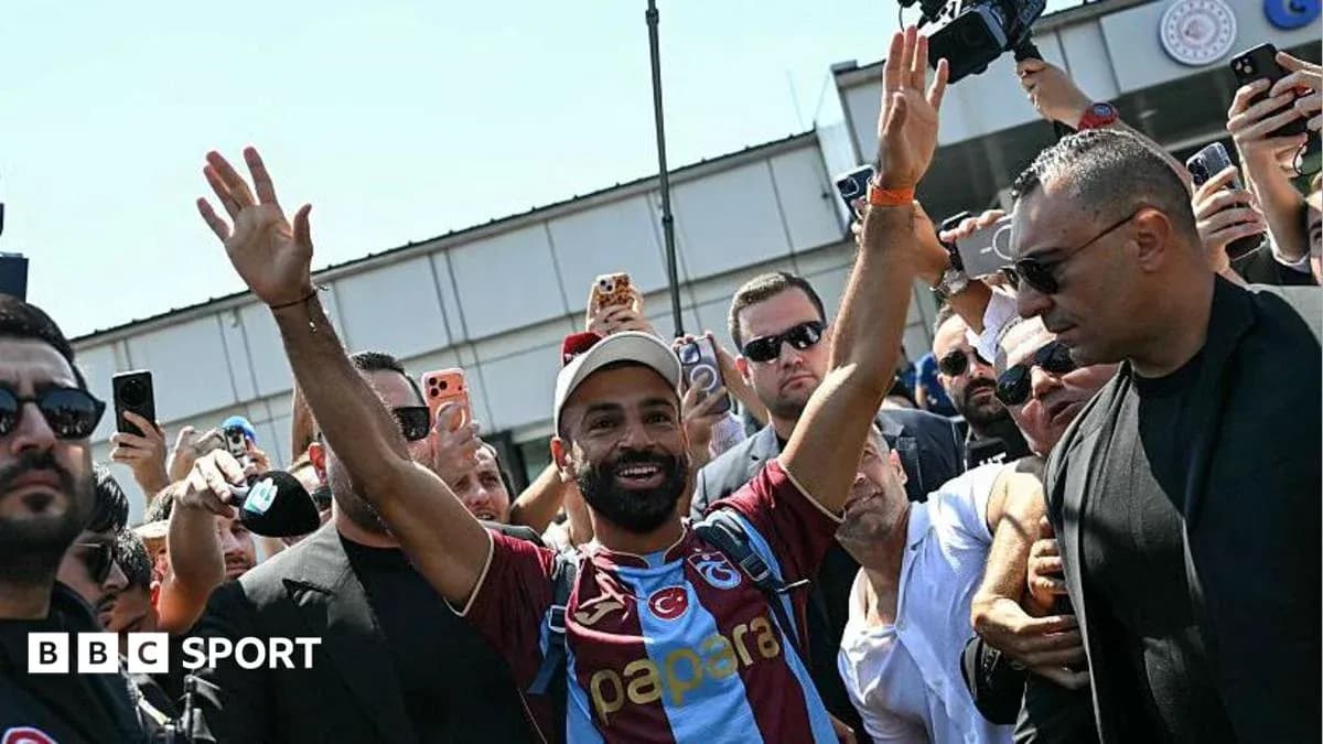 Player greeting fans upon arrival at stadium Player greeting fans upon arrival at stadium