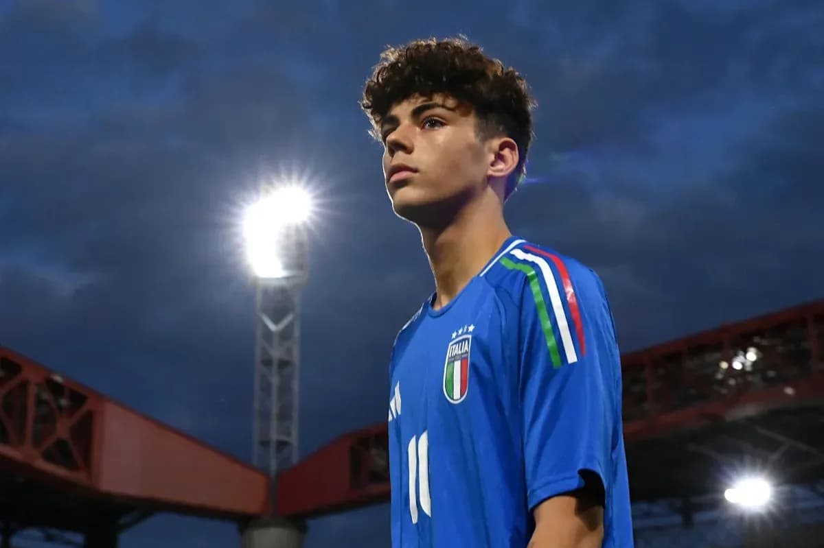 Player in Italy jersey under stadium lights Player in Italy jersey under stadium lights