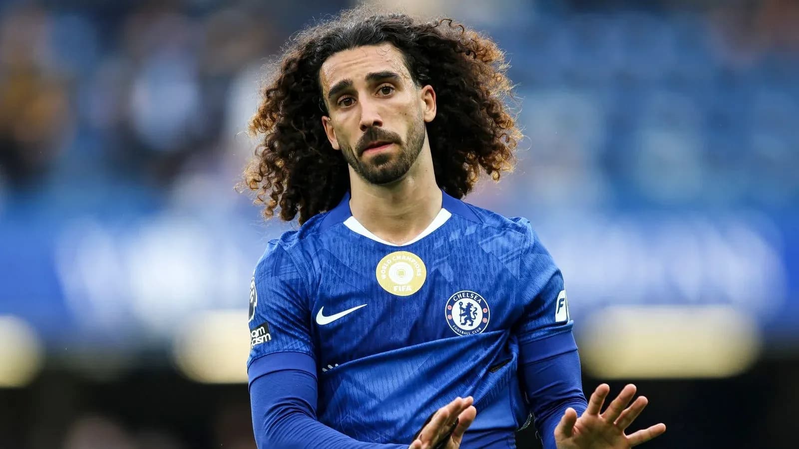 Player in blue Chelsea jersey on the field Player in blue Chelsea jersey on the field