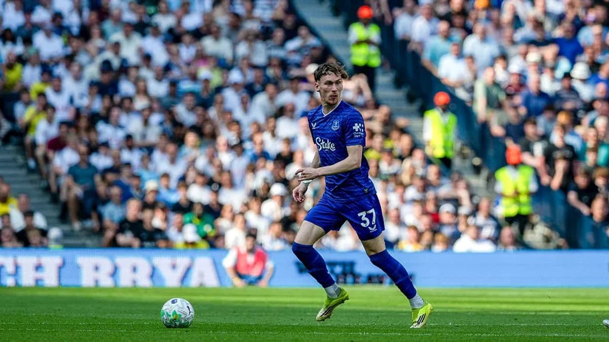 Player in blue kit dribbling on the field Player in blue kit dribbling on the field