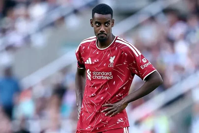 Liverpool player on pitch during match Liverpool player on pitch during match