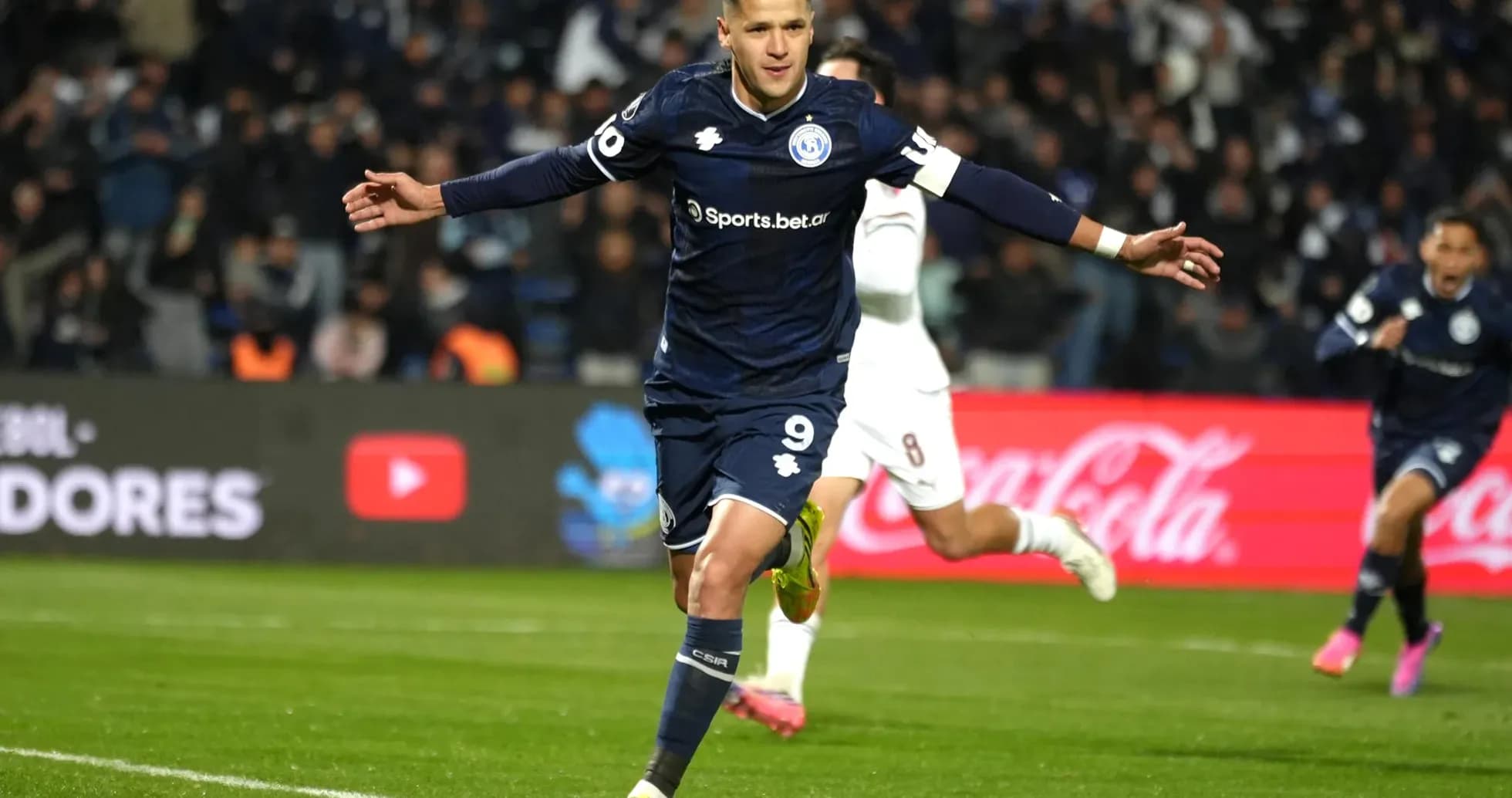 Player celebrating after scoring a goal Player celebrating after scoring a goal