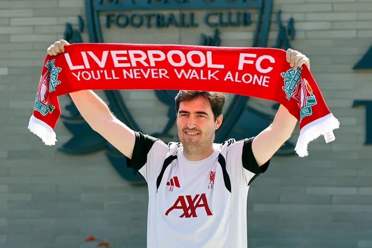 New player holding Liverpool FC scarf at club New player holding Liverpool FC scarf at club
