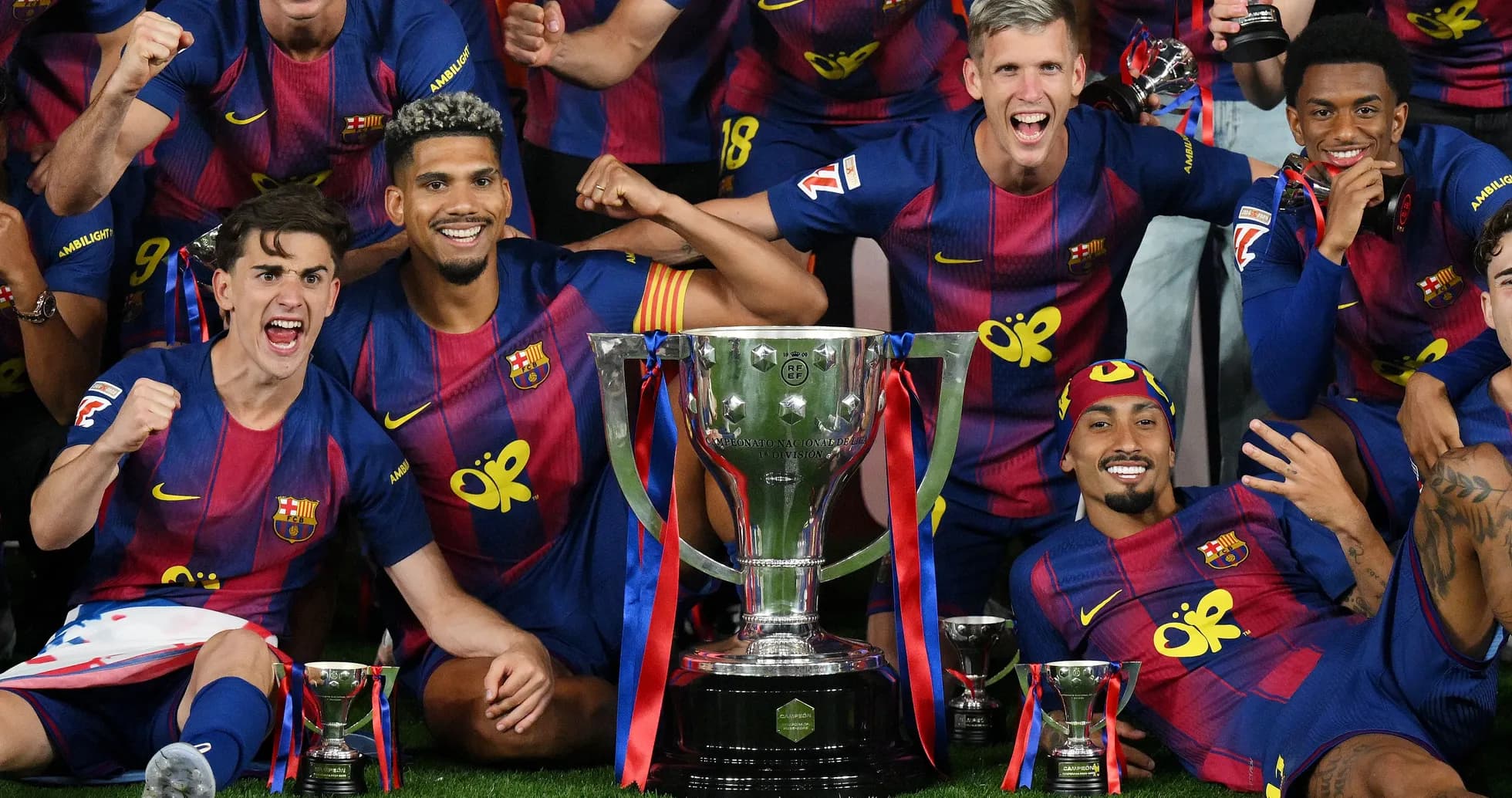 Barcelona players celebrating with trophy after victory Barcelona players celebrating with trophy after victory