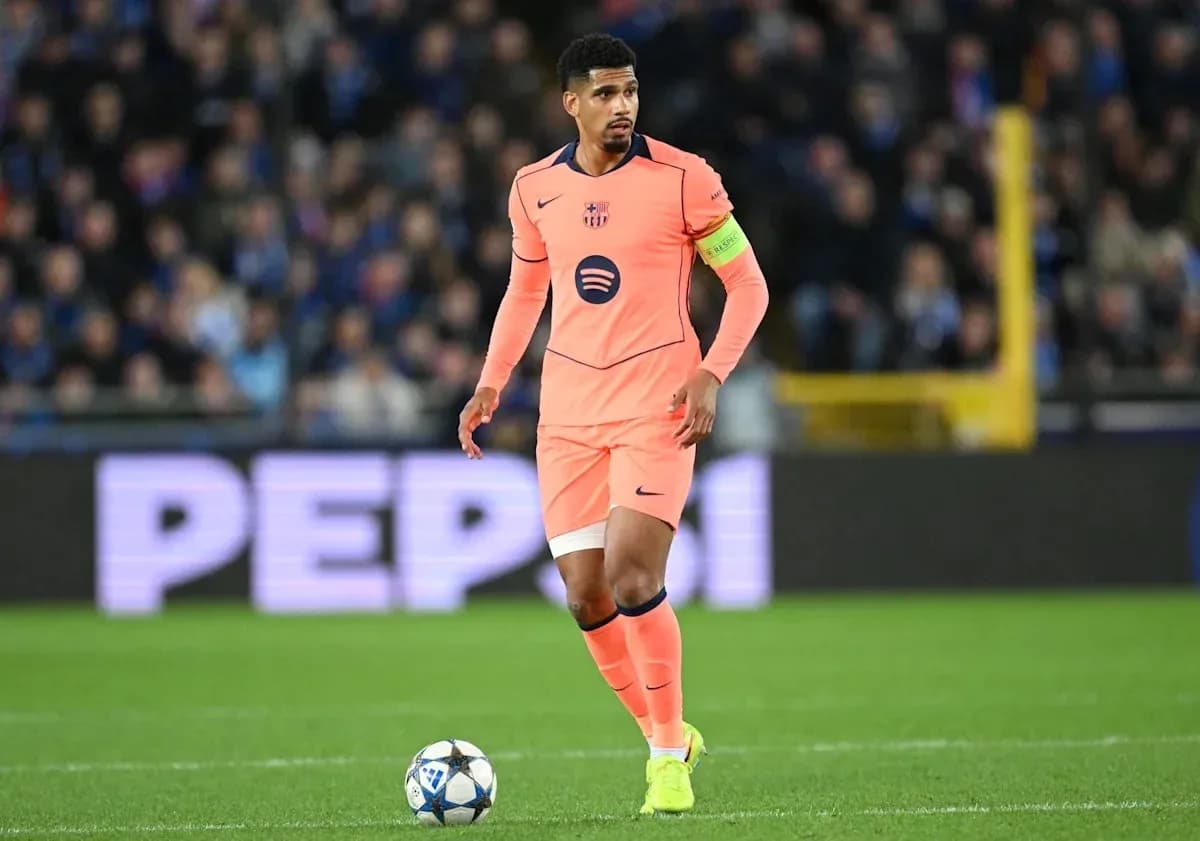 Player in pink jersey dribbling ball on field Player in pink jersey dribbling ball on field