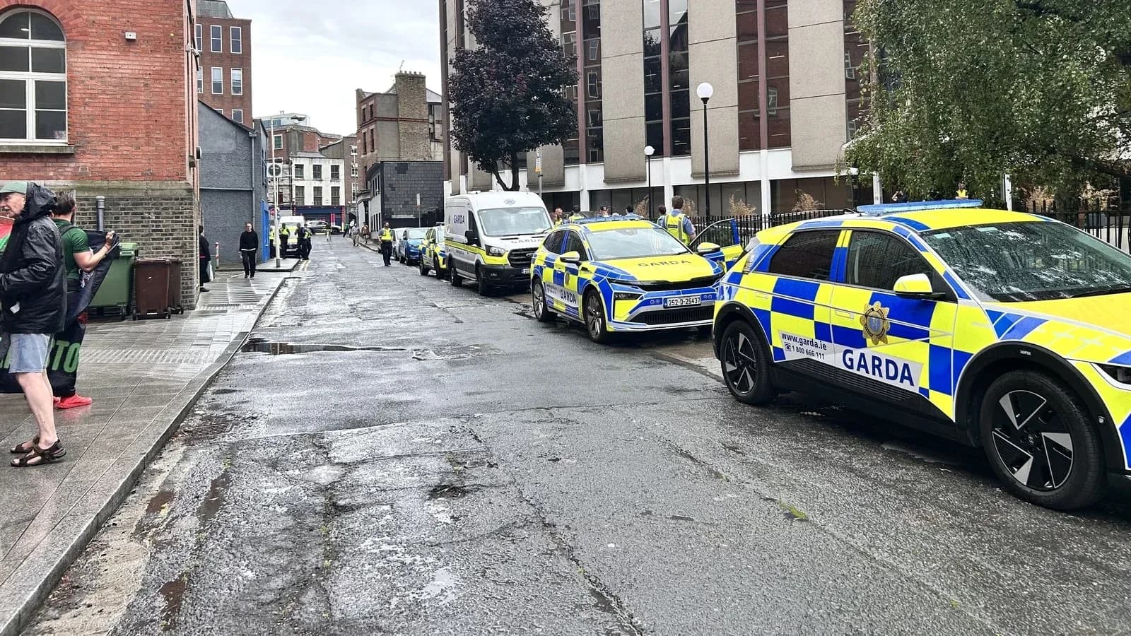 Police vehicles parked on a city street Police vehicles parked on a city street