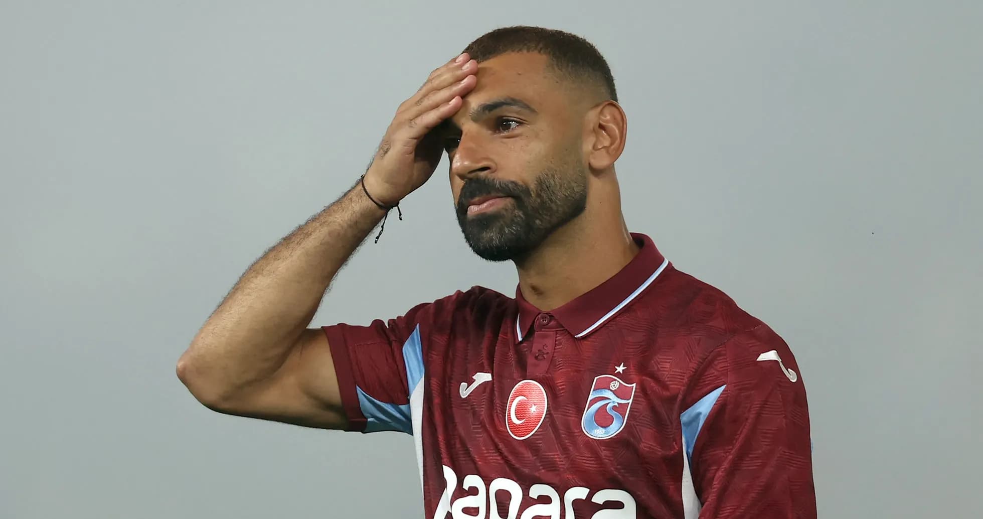 Player wearing Trabzonspor jersey during presentation event Player wearing Trabzonspor jersey during presentation event