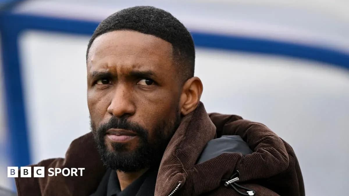 Man with a beard sitting on the sidelines Man with a beard sitting on the sidelines