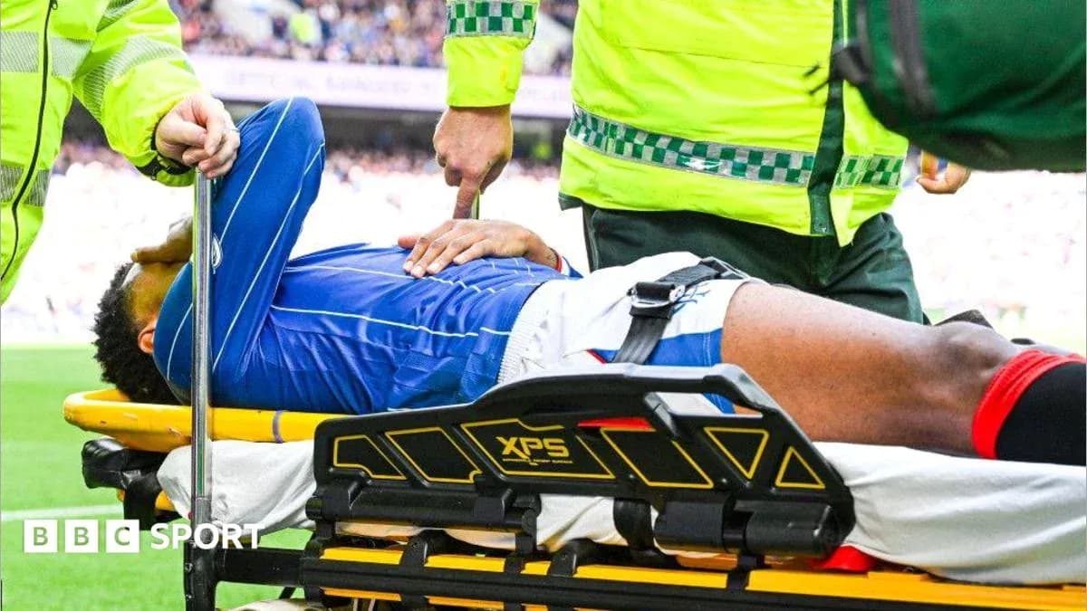 Player being treated on stretcher by medical staff Player being treated on stretcher by medical staff
