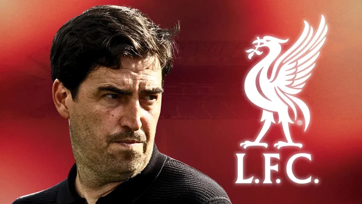 Manager with Liverpool FC logo in background Manager with Liverpool FC logo in background