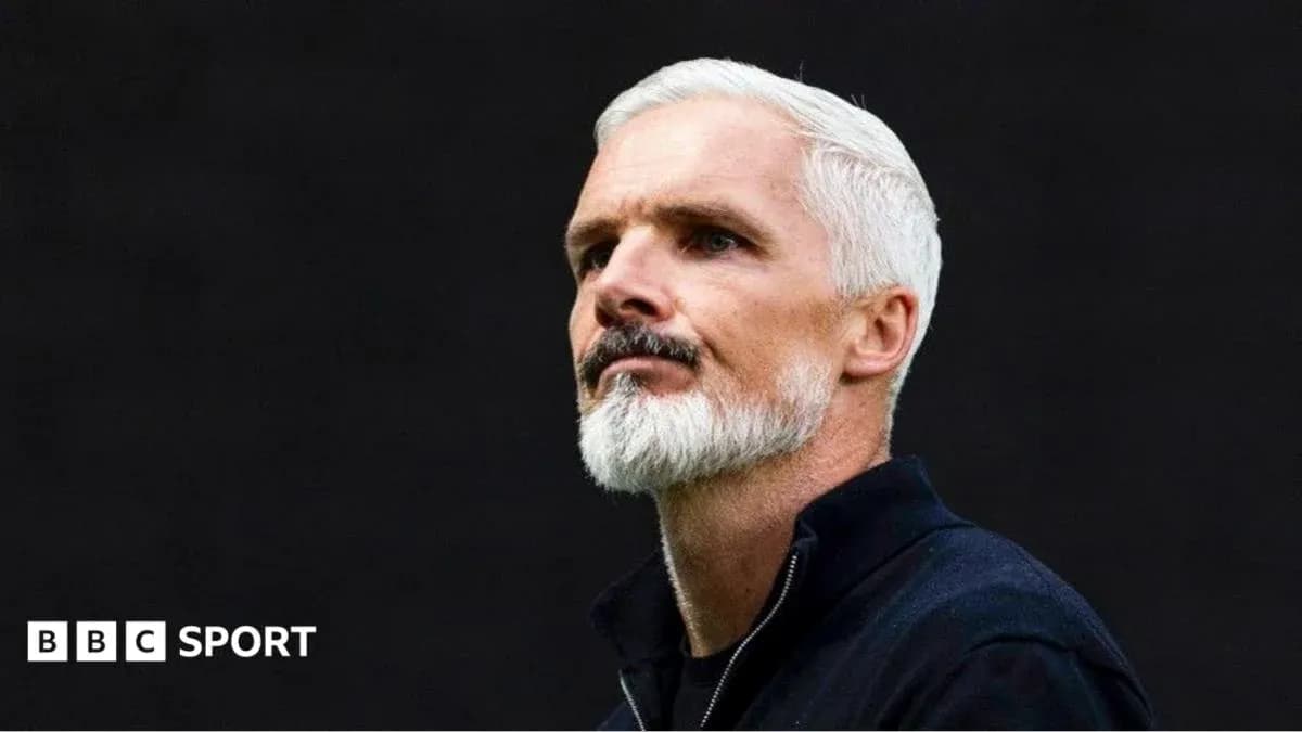 Coach with white hair and beard during event Coach with white hair and beard during event