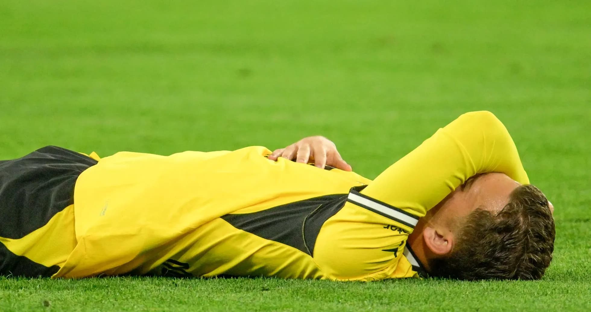 Player lying on pitch after an injury Player lying on pitch after an injury