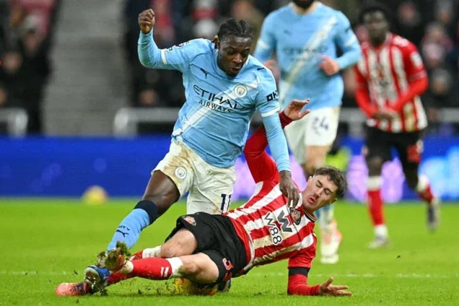 Player tackling opponent during intense football match Player tackling opponent during intense football match