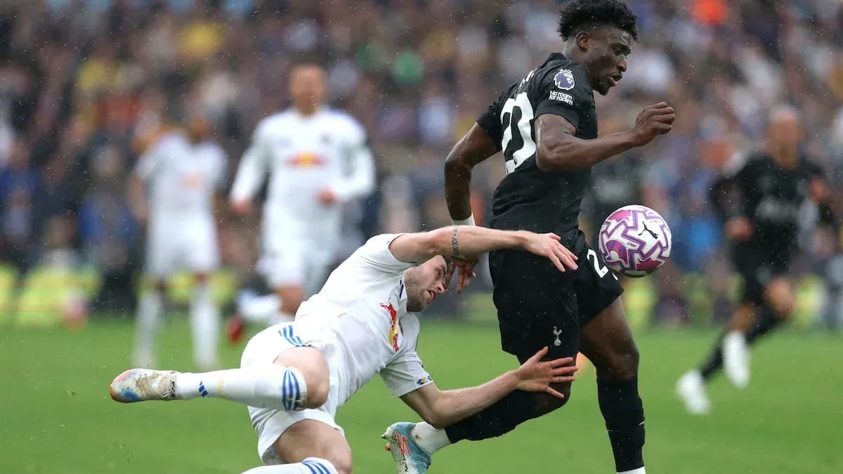 Player tackled while sprinting with the ball Player tackled while sprinting with the ball