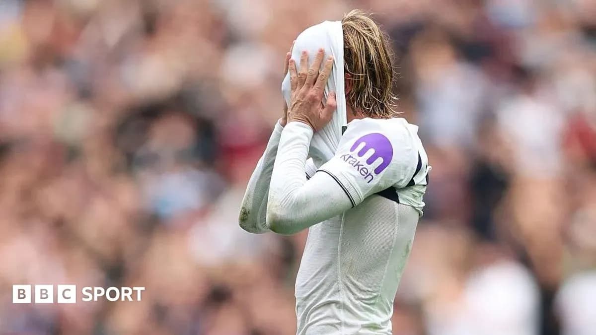 Player covering face with shirt during match Player covering face with shirt during match