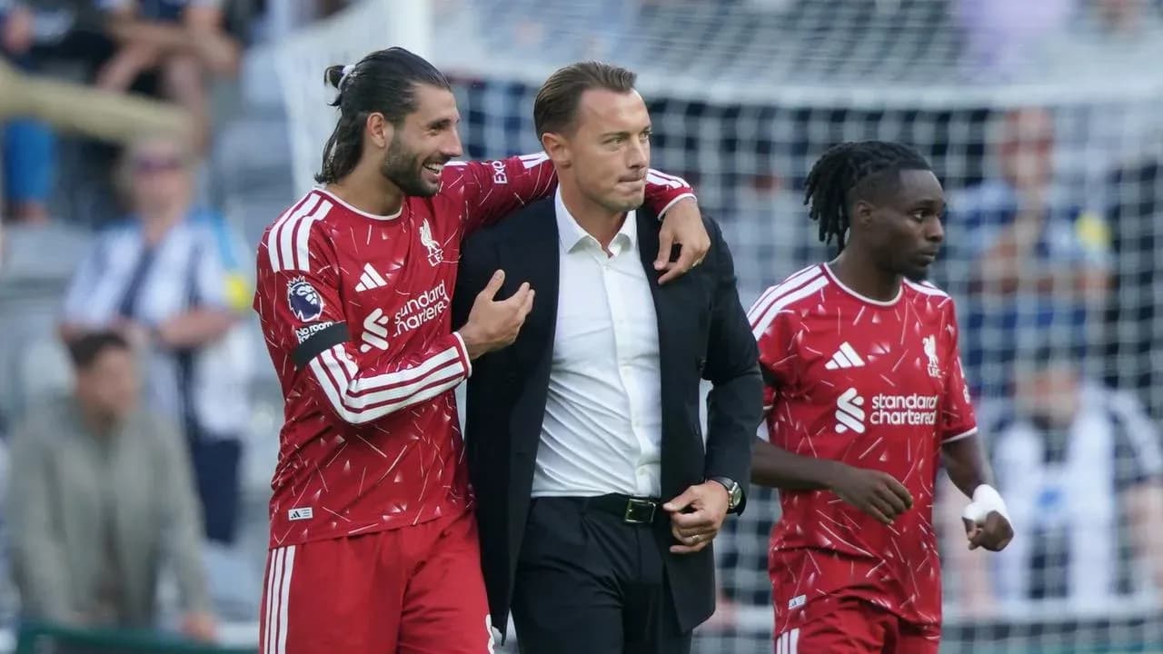 Liverpool players celebrating with the manager after match Liverpool players celebrating with the manager after match