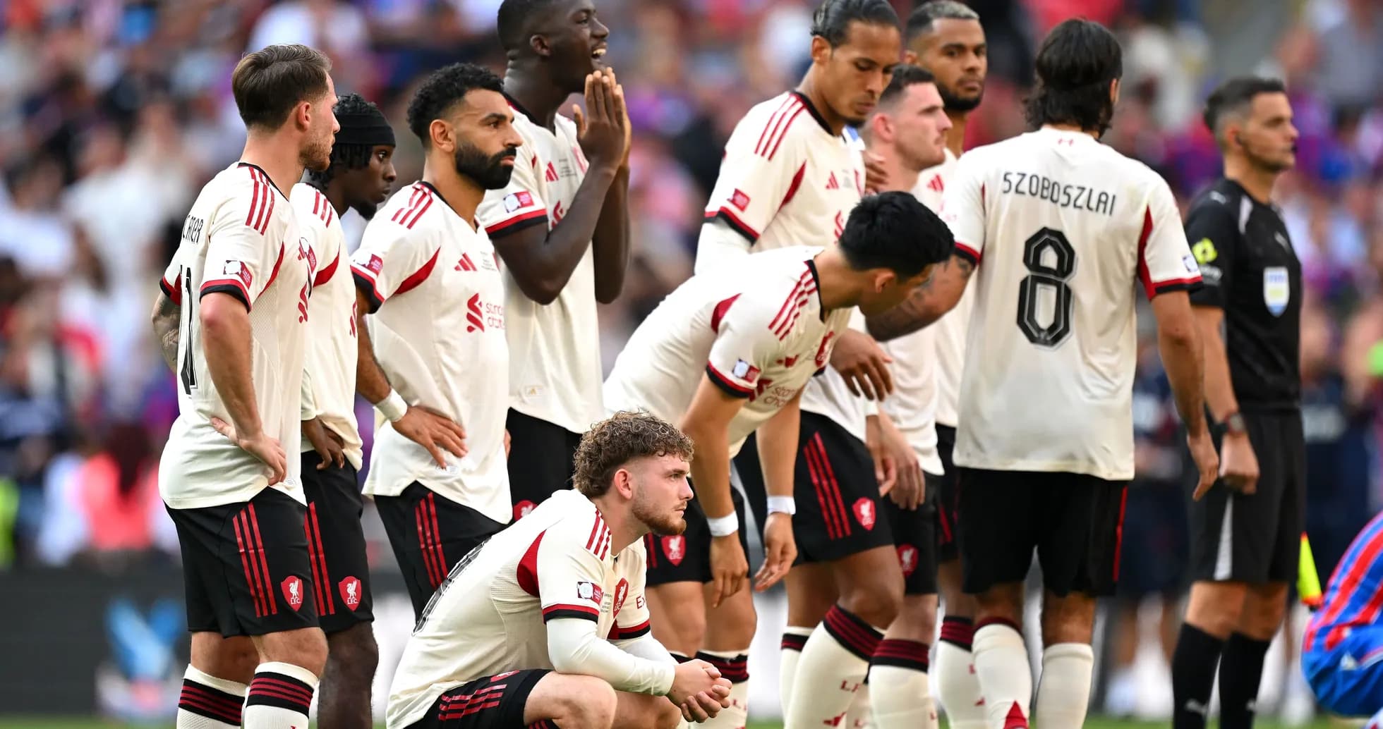 Players in white jerseys during a match moment Players in white jerseys during a match moment