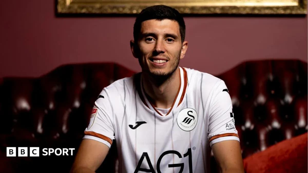 Player posing in Swansea City jersey indoors Player posing in Swansea City jersey indoors