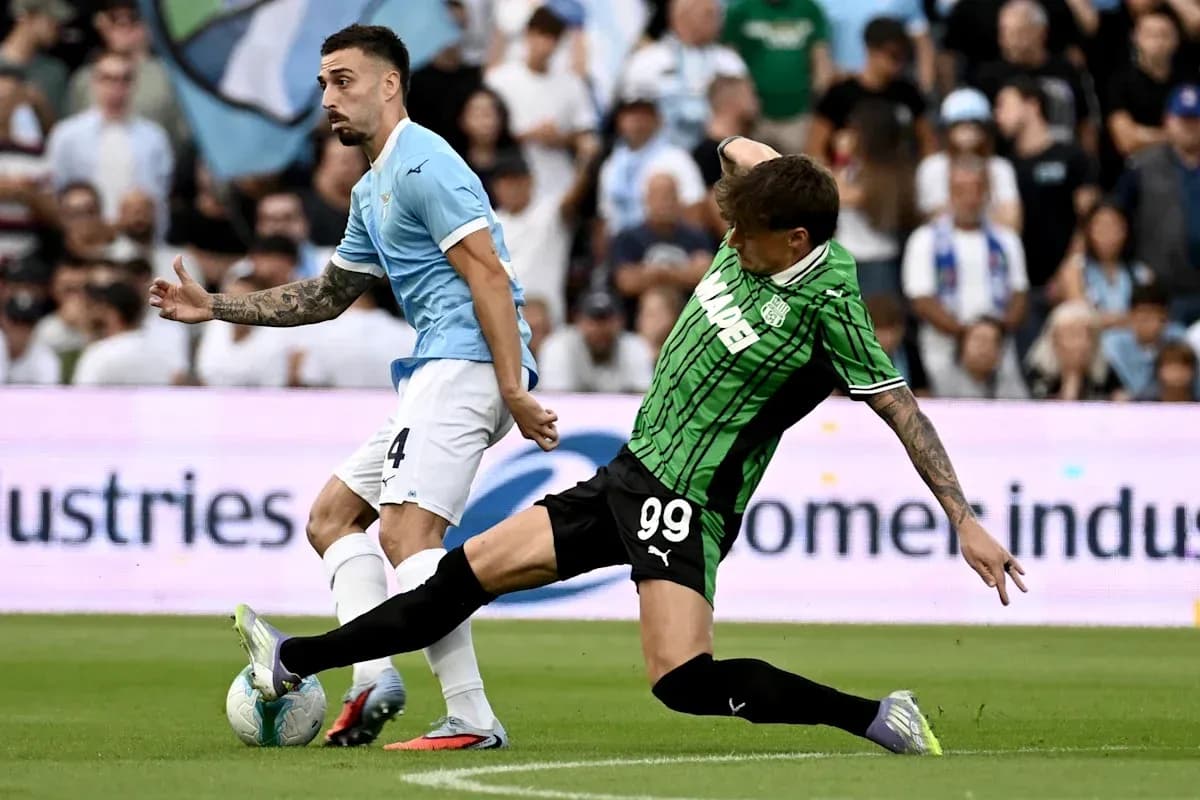 Player from Lazio evading a tackle during match Player from Lazio evading a tackle during match