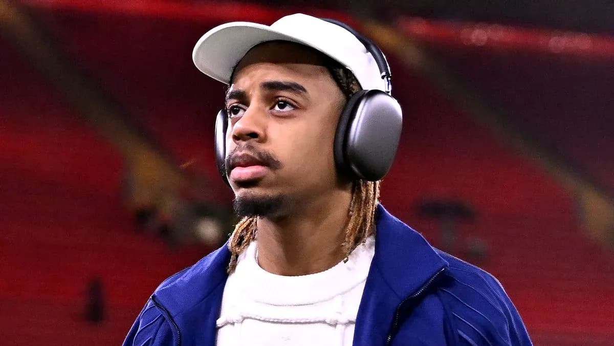 Player wearing headphones before match at stadium Player wearing headphones before match at stadium