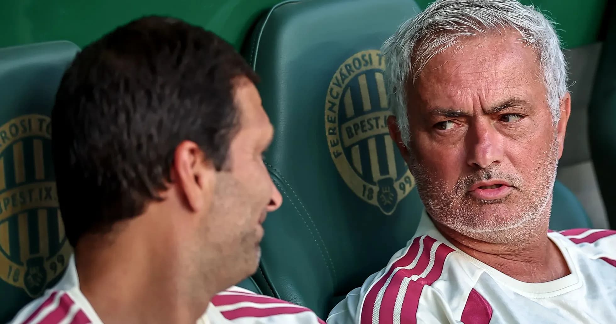 Coaches talking on team bench during match Coaches talking on team bench during match