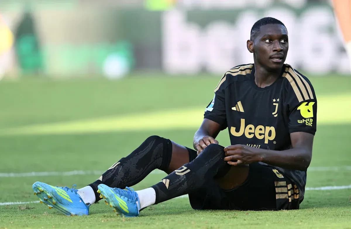 Juventus player sitting on the field during match Juventus player sitting on the field during match