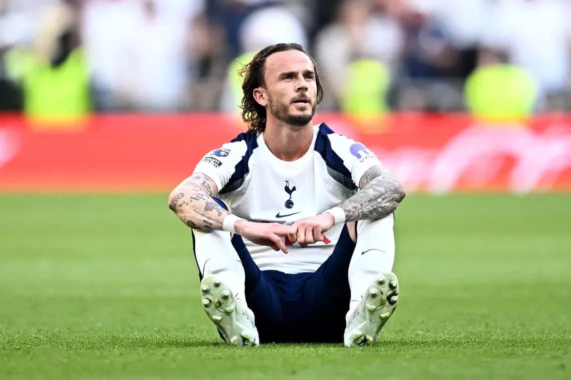 Player sitting on pitch after match with Tottenham kit Player sitting on pitch after match with Tottenham kit