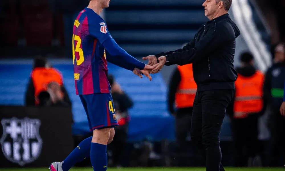 Player and coach exchanging handshake on field Player and coach exchanging handshake on field