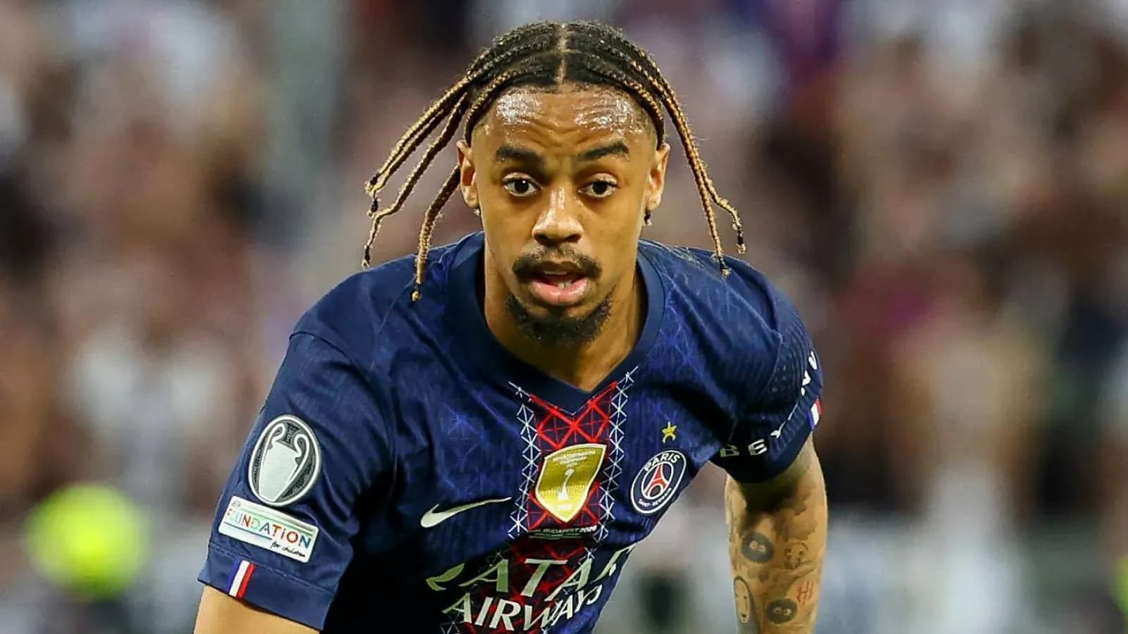 Player in Paris Saint-Germain kit running with ball Player in Paris Saint-Germain kit running with ball