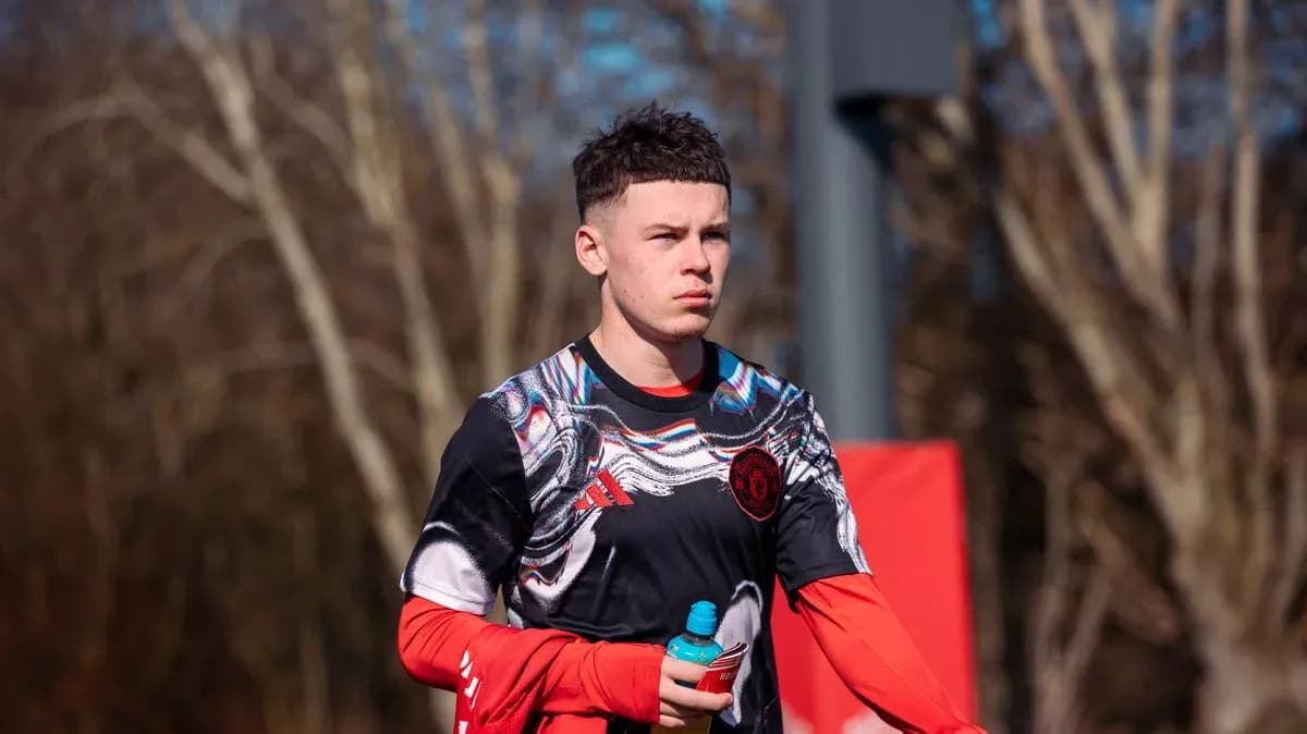 Player walking during training session holding a drink Player walking during training session holding a drink