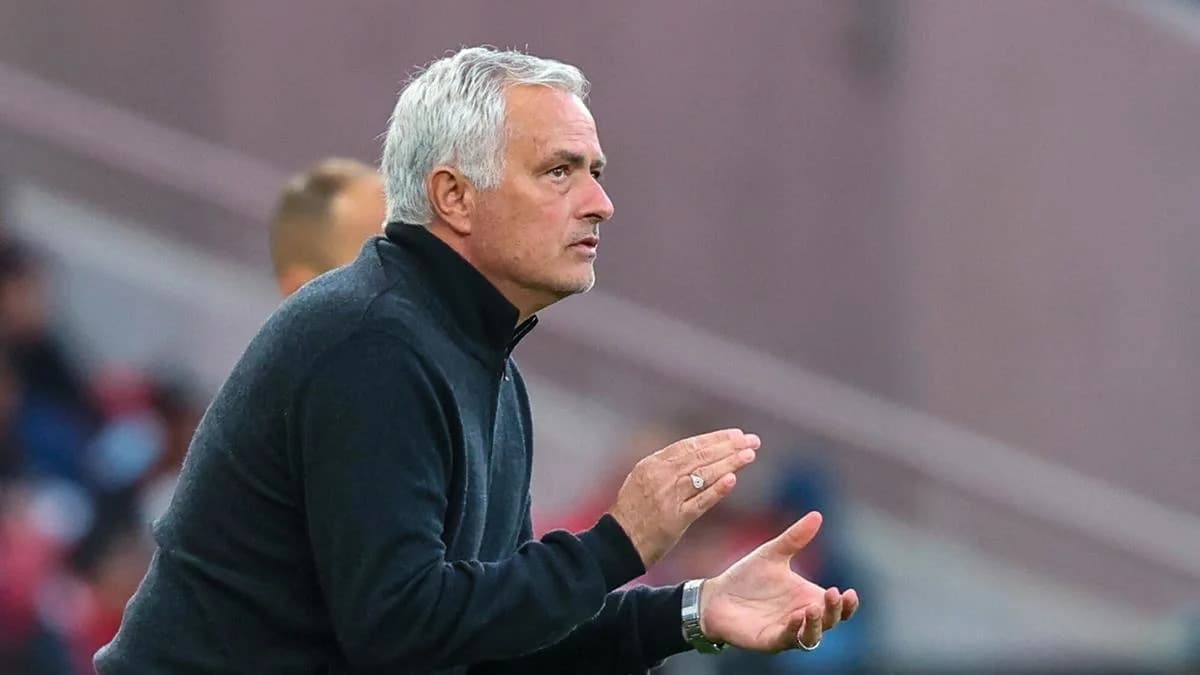 Manager gesturing during a match on the sidelines Manager gesturing during a match on the sidelines