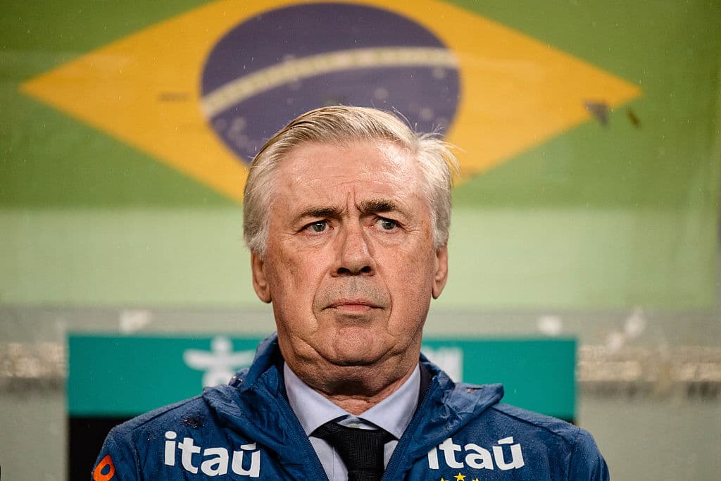 Coach standing in front of Brazilian flag backdrop Coach standing in front of Brazilian flag backdrop