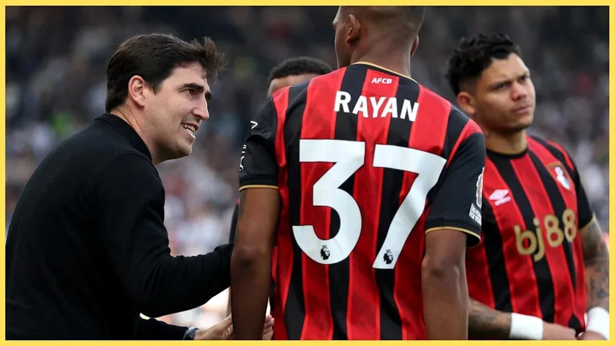Coach discussing strategy with Bournemouth players during match Coach discussing strategy with Bournemouth players during match