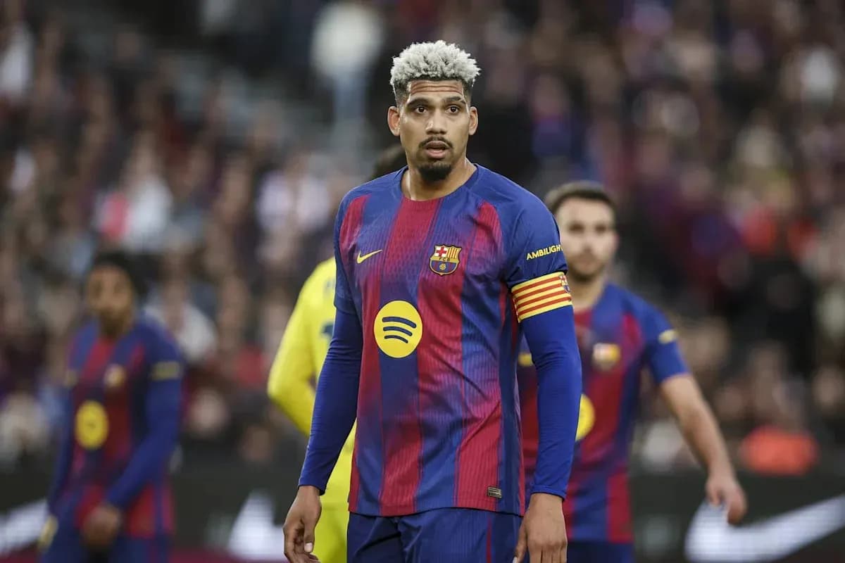 Barcelona player wearing captain's armband on pitch Barcelona player wearing captain's armband on pitch