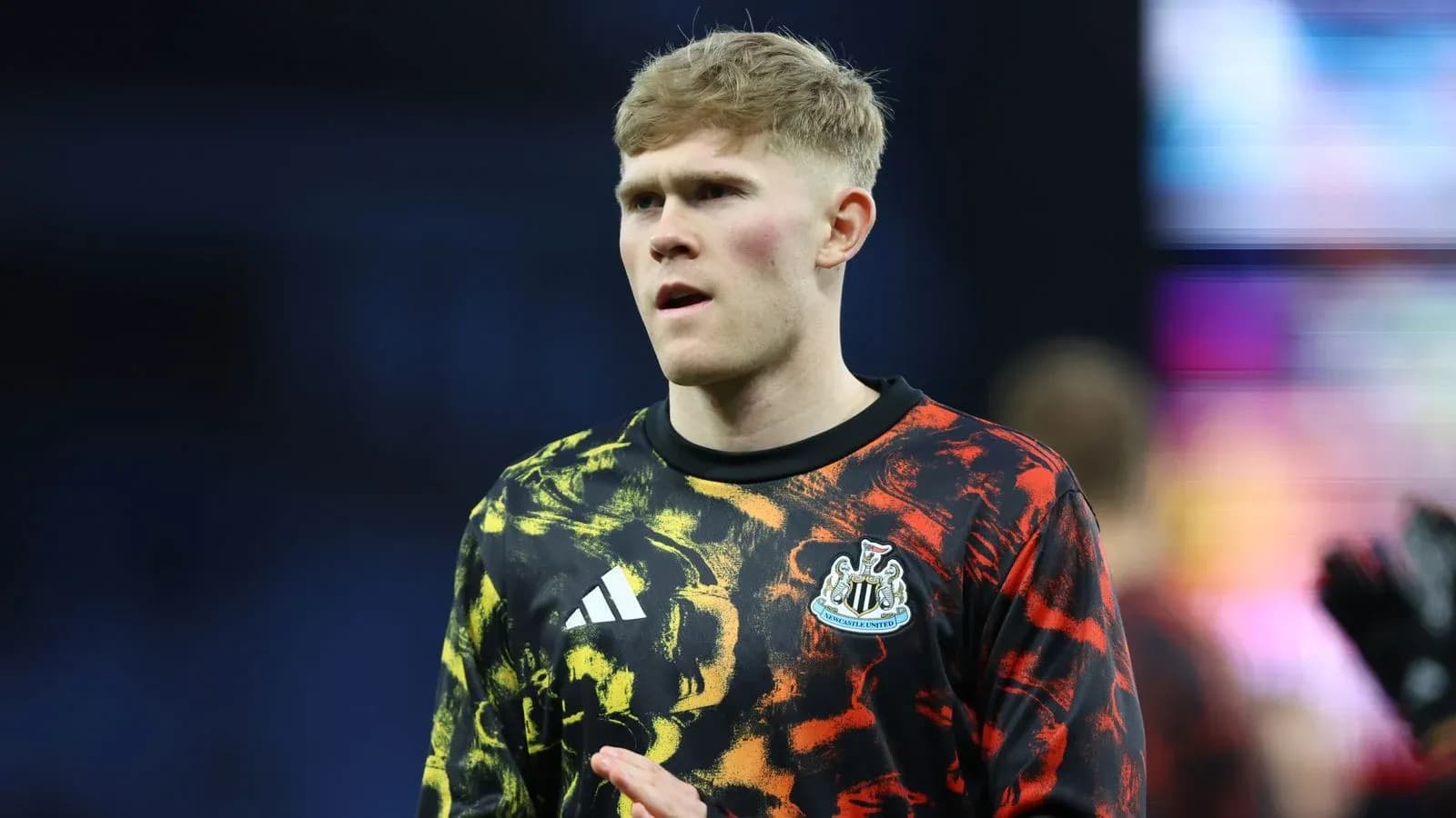 Player in Newcastle United warm-up jersey on pitch Player in Newcastle United warm-up jersey on pitch