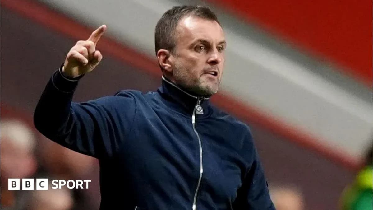 Manager gesturing during a match from the sidelines Manager gesturing during a match from the sidelines
