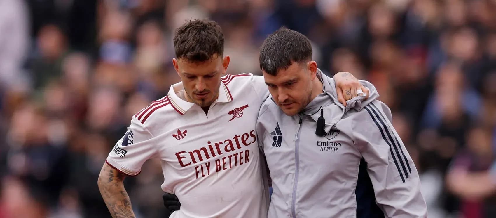 Player receiving assistance off the field after injury Player receiving assistance off the field after injury