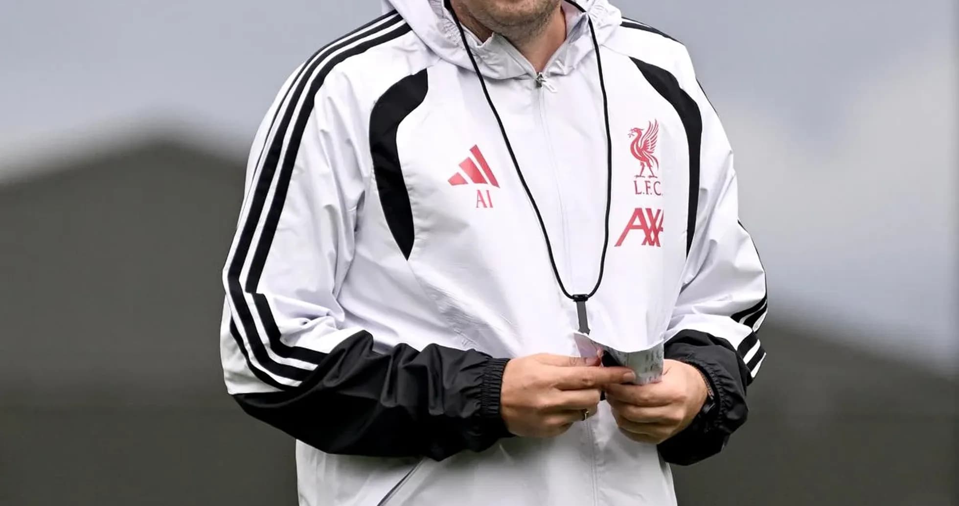 Assistant coach walking during training session Assistant coach walking during training session