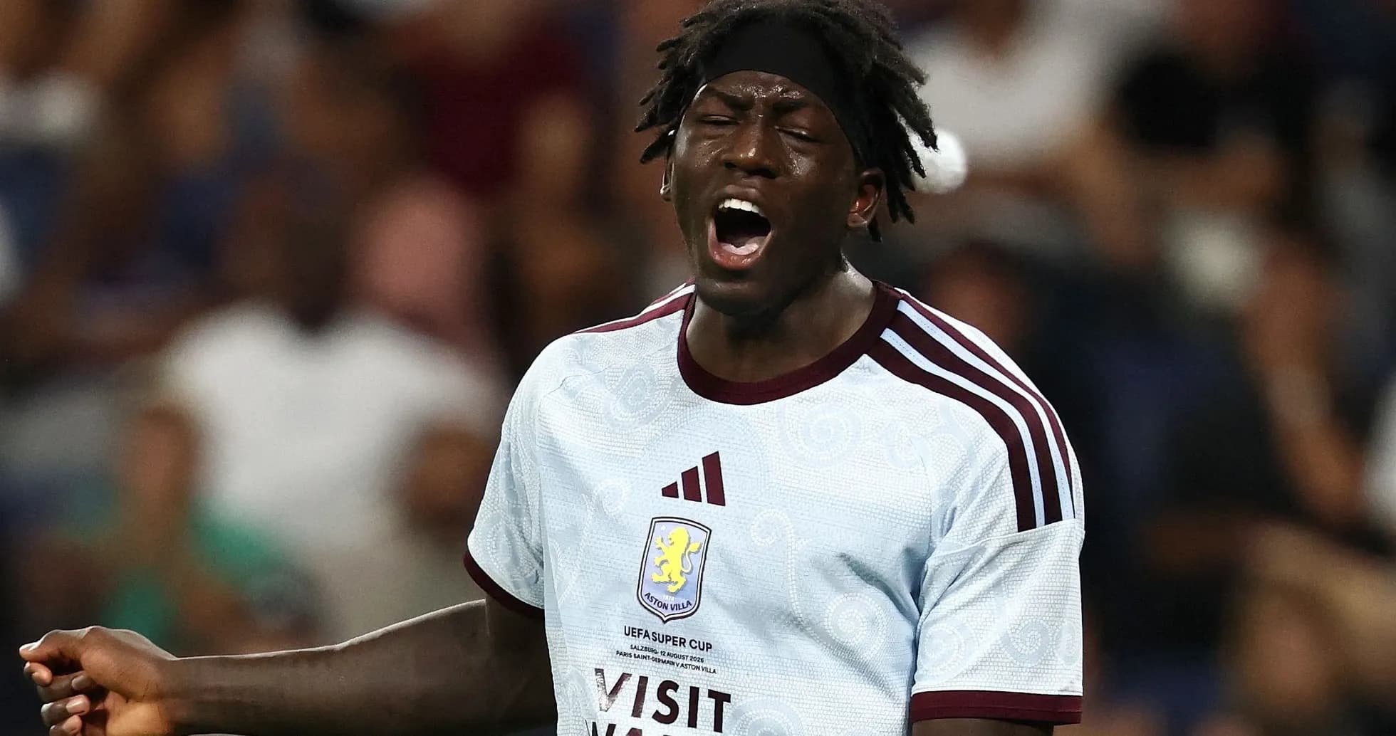 Player shouting during a match wearing Aston Villa jersey Player shouting during a match wearing Aston Villa jersey