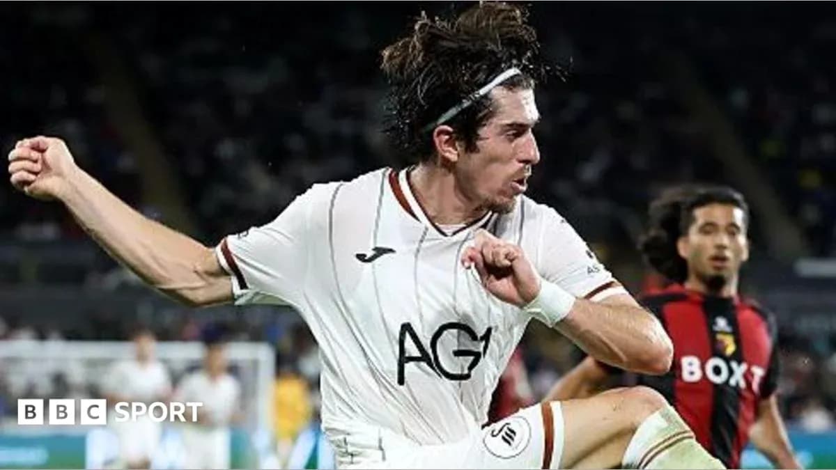 Player kicking the ball during a match Player kicking the ball during a match