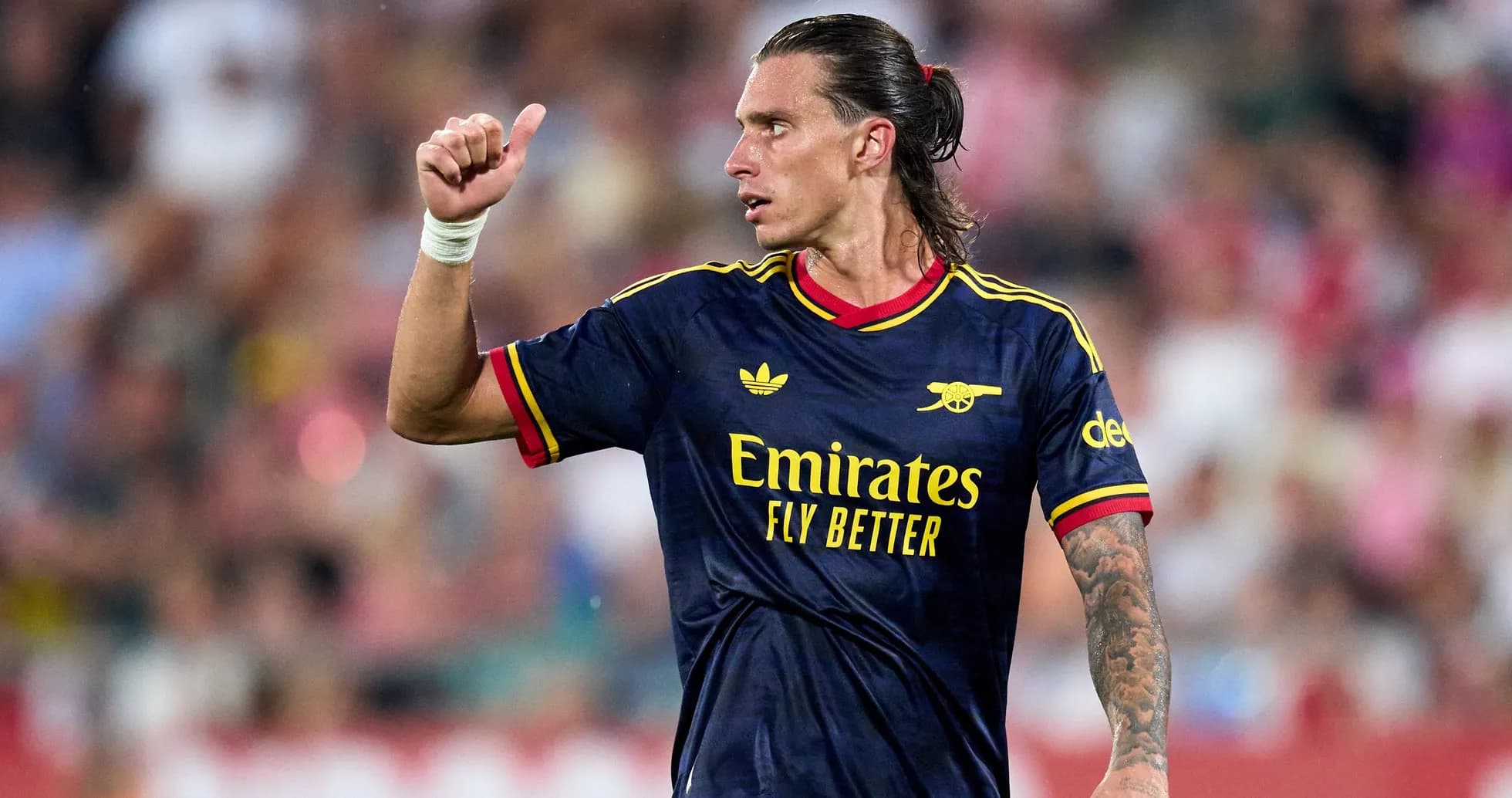 Player gesturing during match in Arsenal kit Player gesturing during match in Arsenal kit
