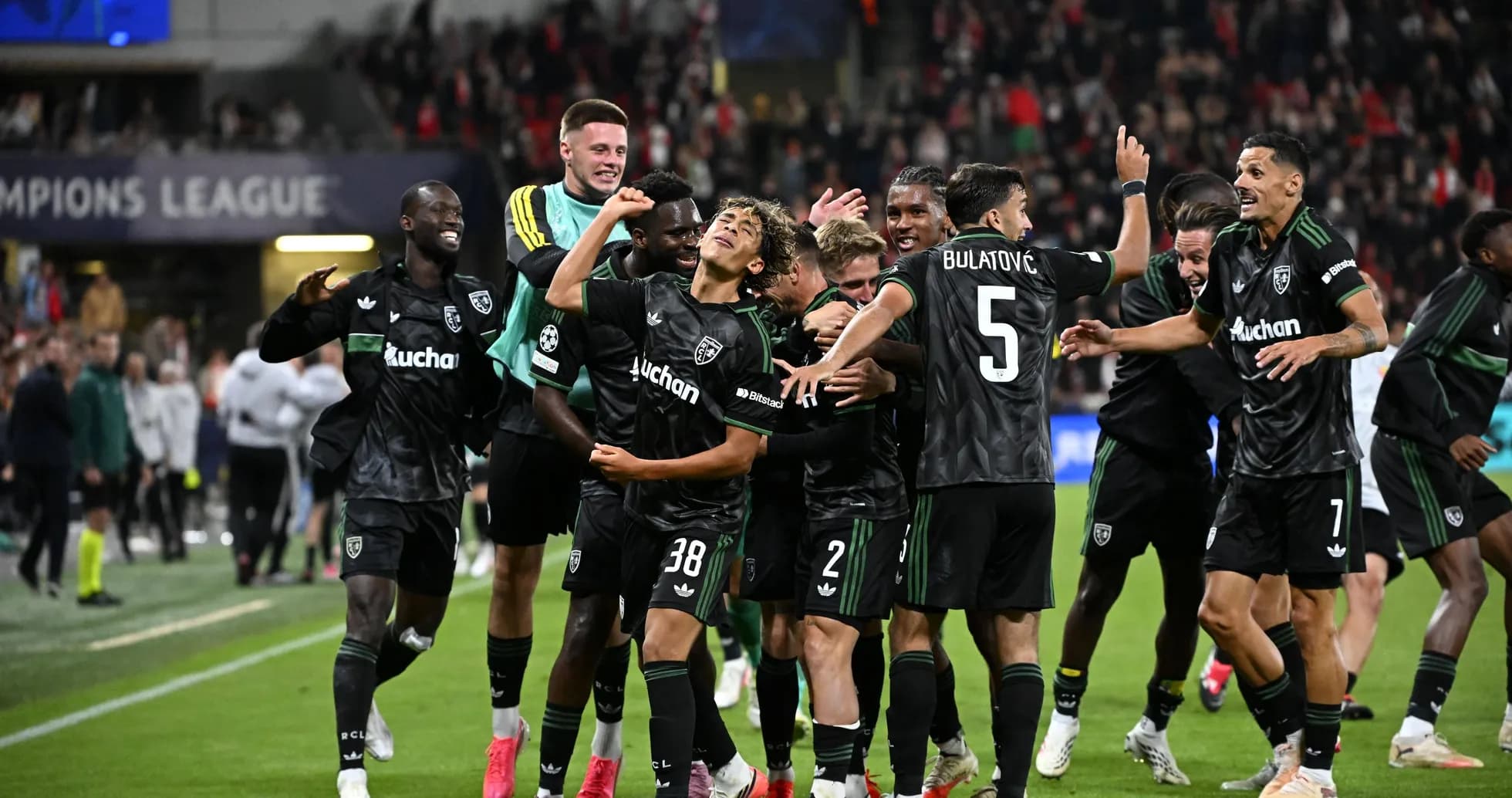 Players celebrating after scoring a goal in Champions League Players celebrating after scoring a goal in Champions League