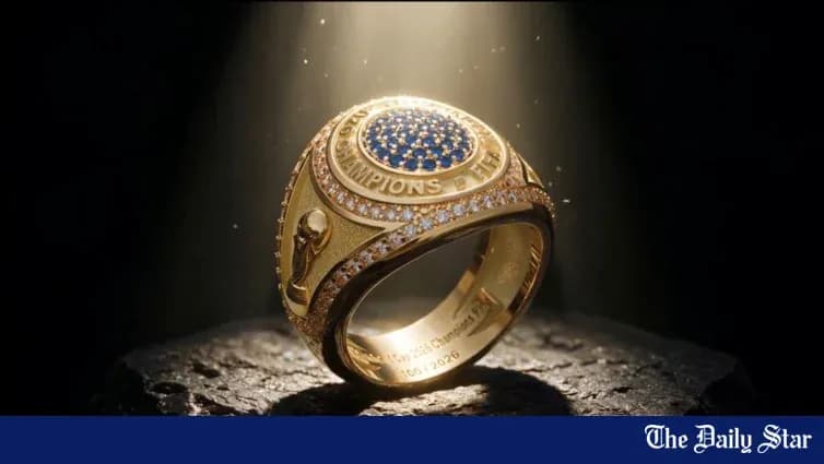 Championship ring displayed on a stone surface Championship ring displayed on a stone surface
