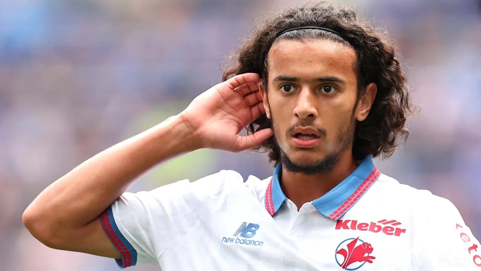 Player with curly hair gesturing during match Player with curly hair gesturing during match