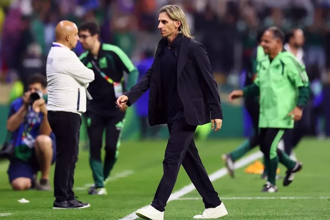 Coach walking on the pitch after the match Coach walking on the pitch after the match