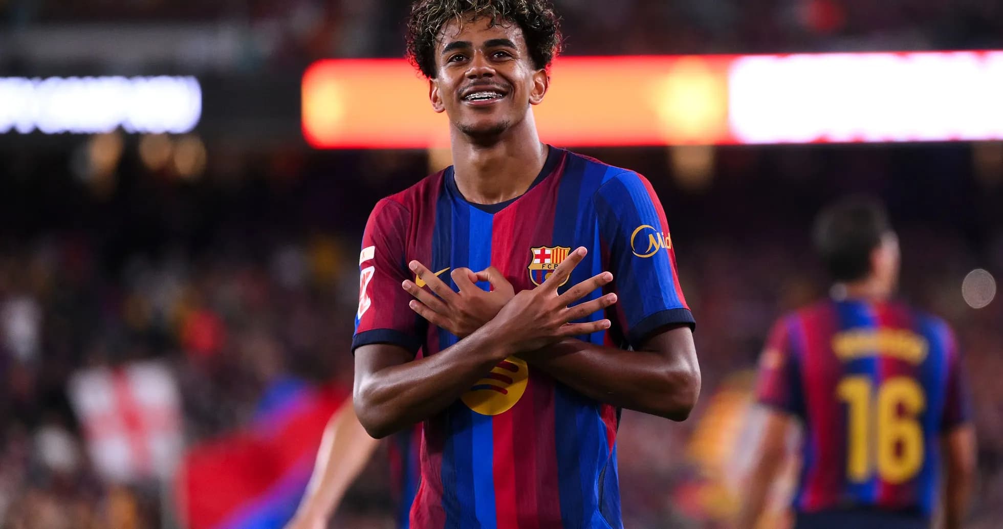 Barcelona player celebrating a goal on the pitch Barcelona player celebrating a goal on the pitch