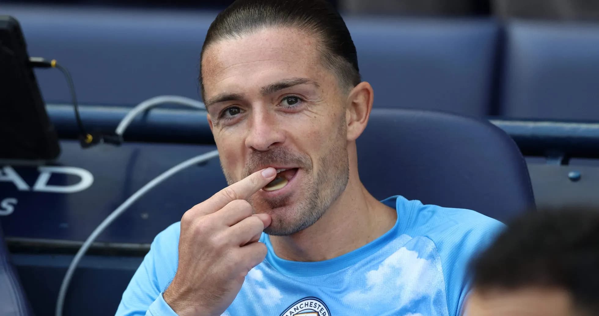 Player eating while sitting on the bench Player eating while sitting on the bench